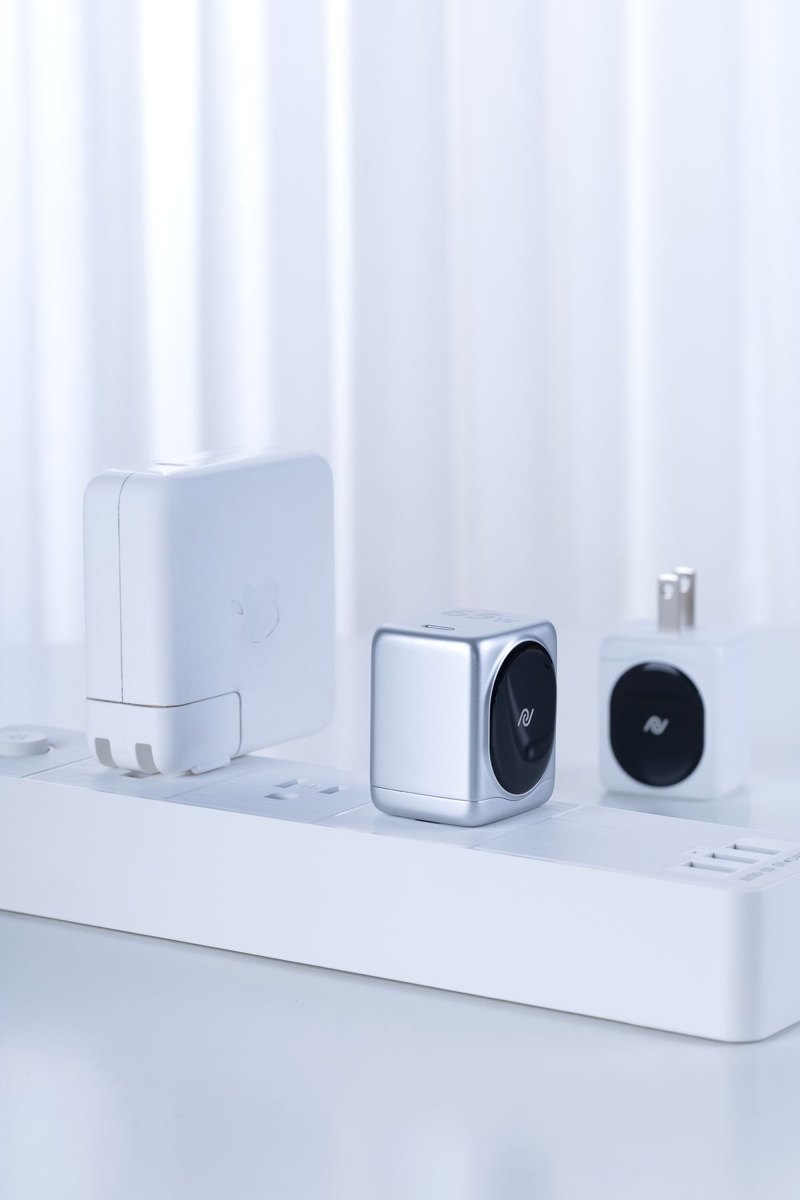 Power strip with plug-in charging adapters