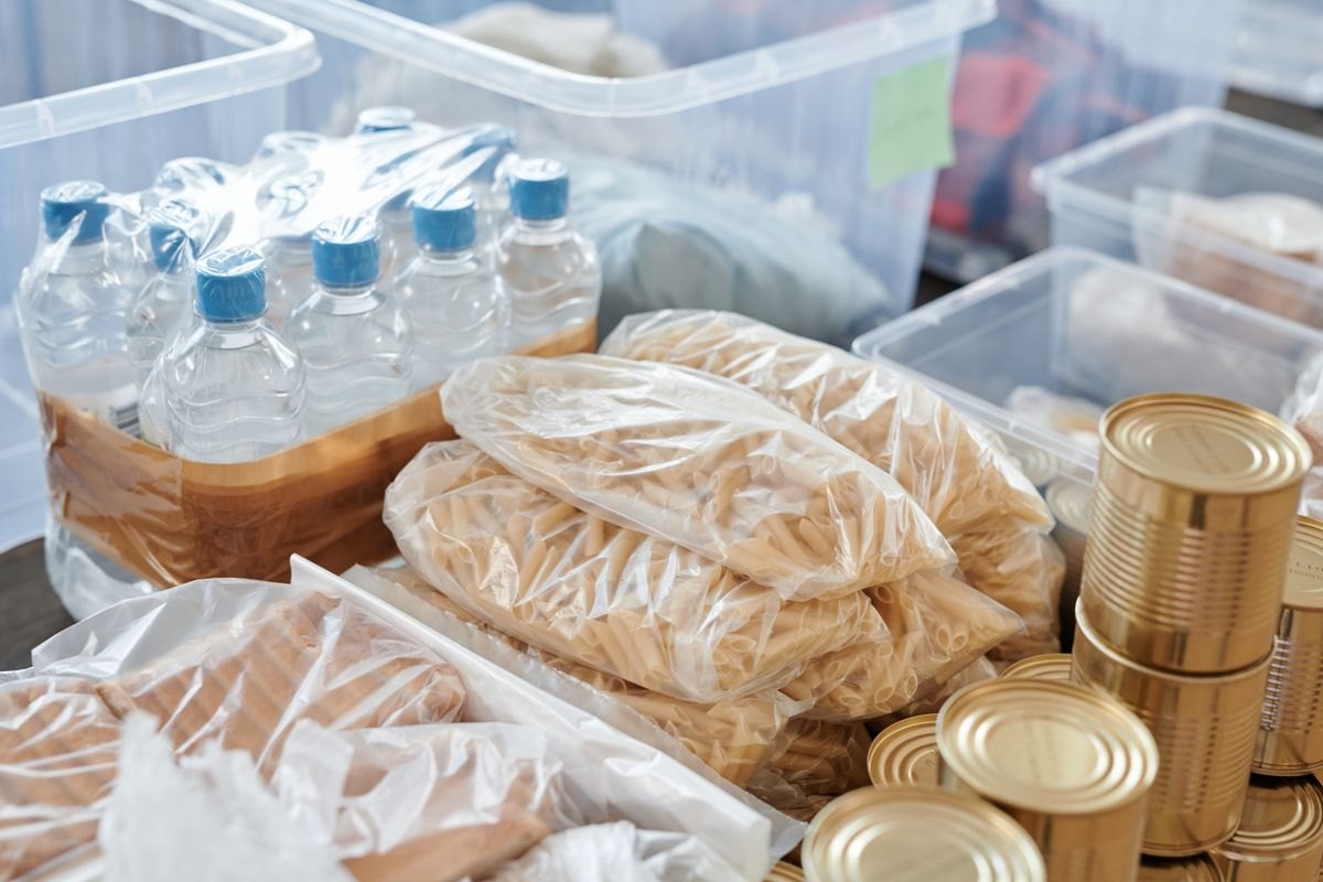 Bottled water and packaged supplies arranged together