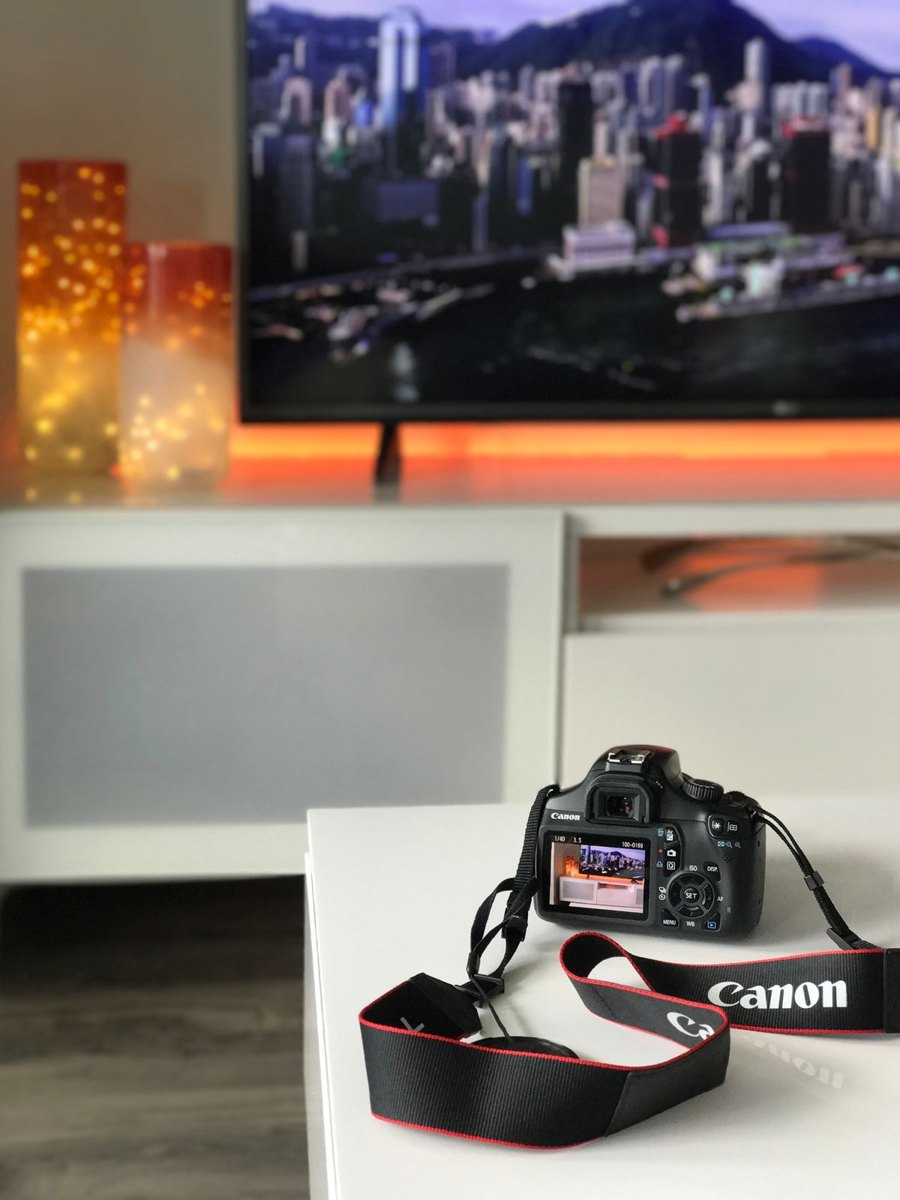 Camera on a table facing a furnished living room