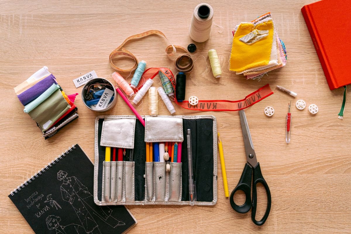 Sewing supplies with threads, scissors and fabric